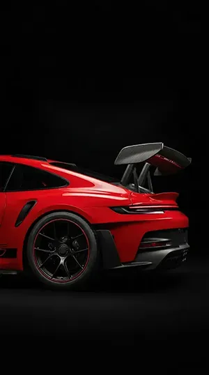 The red porsche 911 car in dark background.